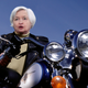 Image for article titled Motorcycle-Revving Janet Yellen Folds Up Picture Of Cryptocurrency Before Speeding Away